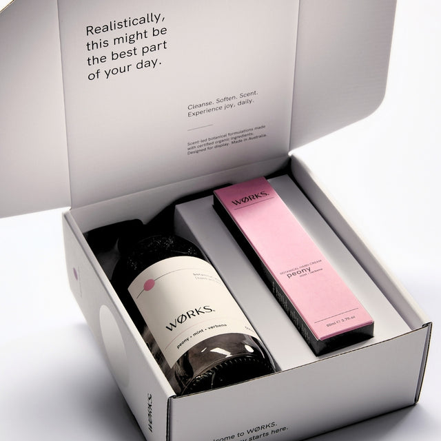 WØRKS Peony Gift Box open, showing Botanical Wash and Botanical Hand Cream inside FSC-certified packaging