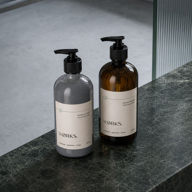 WØRKS Cumquat Duo — Botanical Wash and Botanical Balm 500ml styled in situ on a bathroom shelf