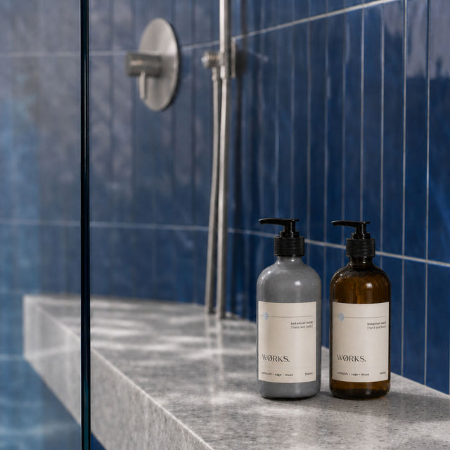 WØRKS Saltbush Duo — Botanical Wash and Botanical Balm 500ml styled in situ on a bathroom shelf