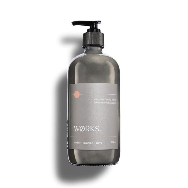 Amber 500ml body balm in WØRKS signature packaging, photographed on a clean white background