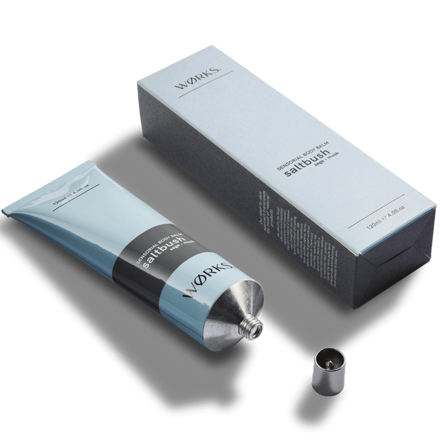 Saltbush 120ml body balm tube with minimal design and luxurious texture, captured in soft natural light