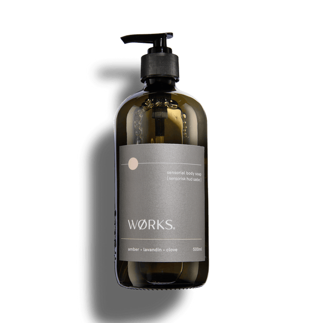 Amber 500ml body soap in WØRKS signature packaging, photographed on a clean white background