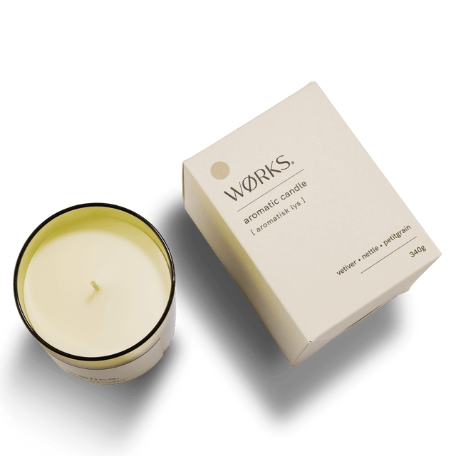 Vetiver candle in smoked glass vessel with matching box, shot on neutral background