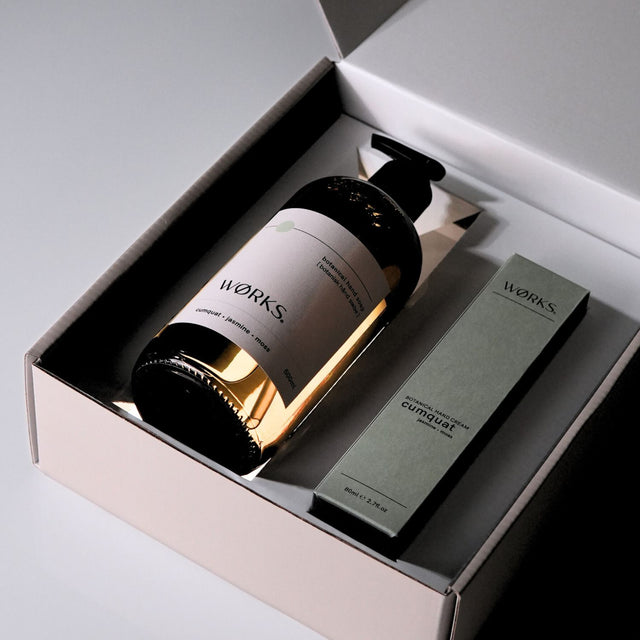 Cumquat gift box open with minimal design and luxurious texture, captured in soft natural light