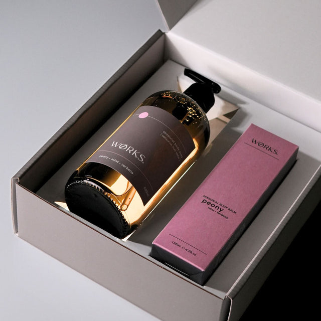 Open gift box with Peony products emerging from inside, styled for visual impact