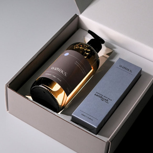 WØRKS Saltbush gift box opened to reveal product pairing in aesthetic composition