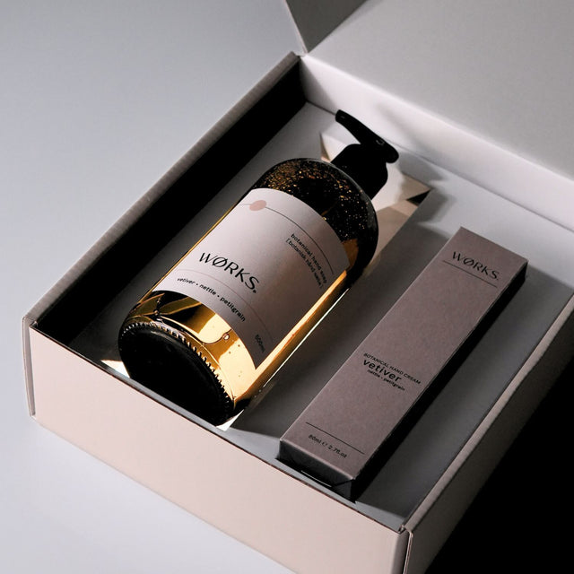 Open gift box with Vetiver products emerging from inside, styled for visual impact