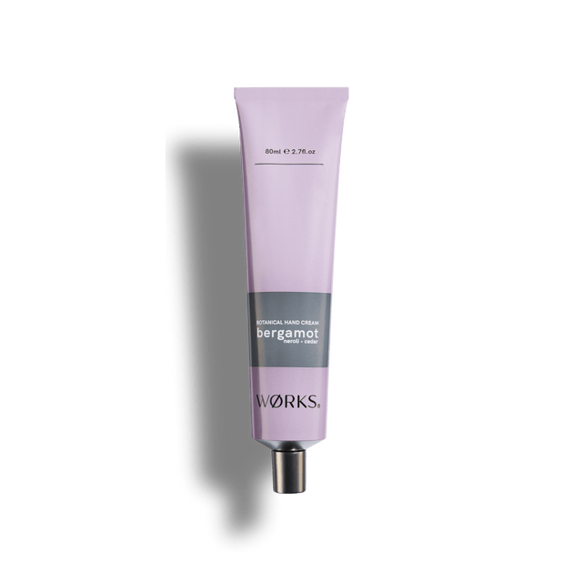 Bergamot 80ml hand cream tube in WØRKS signature packaging, photographed on a clean white background