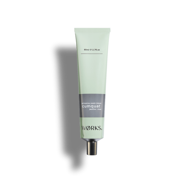 Cumquat 80ml hand cream tube in WØRKS signature packaging, photographed on a clean white background
