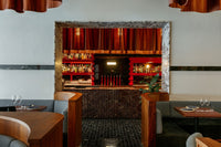 The Fugazzi dining room on Leigh Street, Adelaide, with a red bar and velvet curtains
