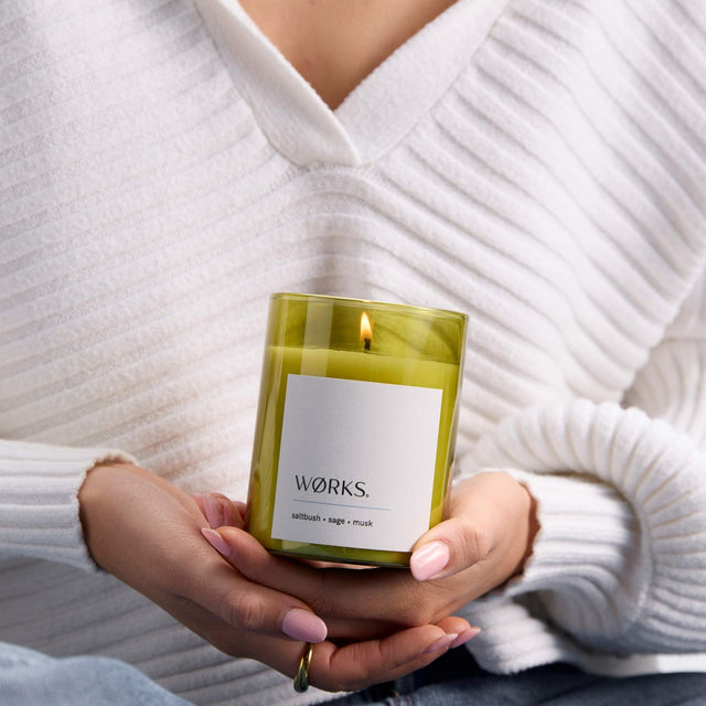 WØRKS Saltbush Candle in deep green glass — a grounding, herbal blend of saltbush, sage, and musk.