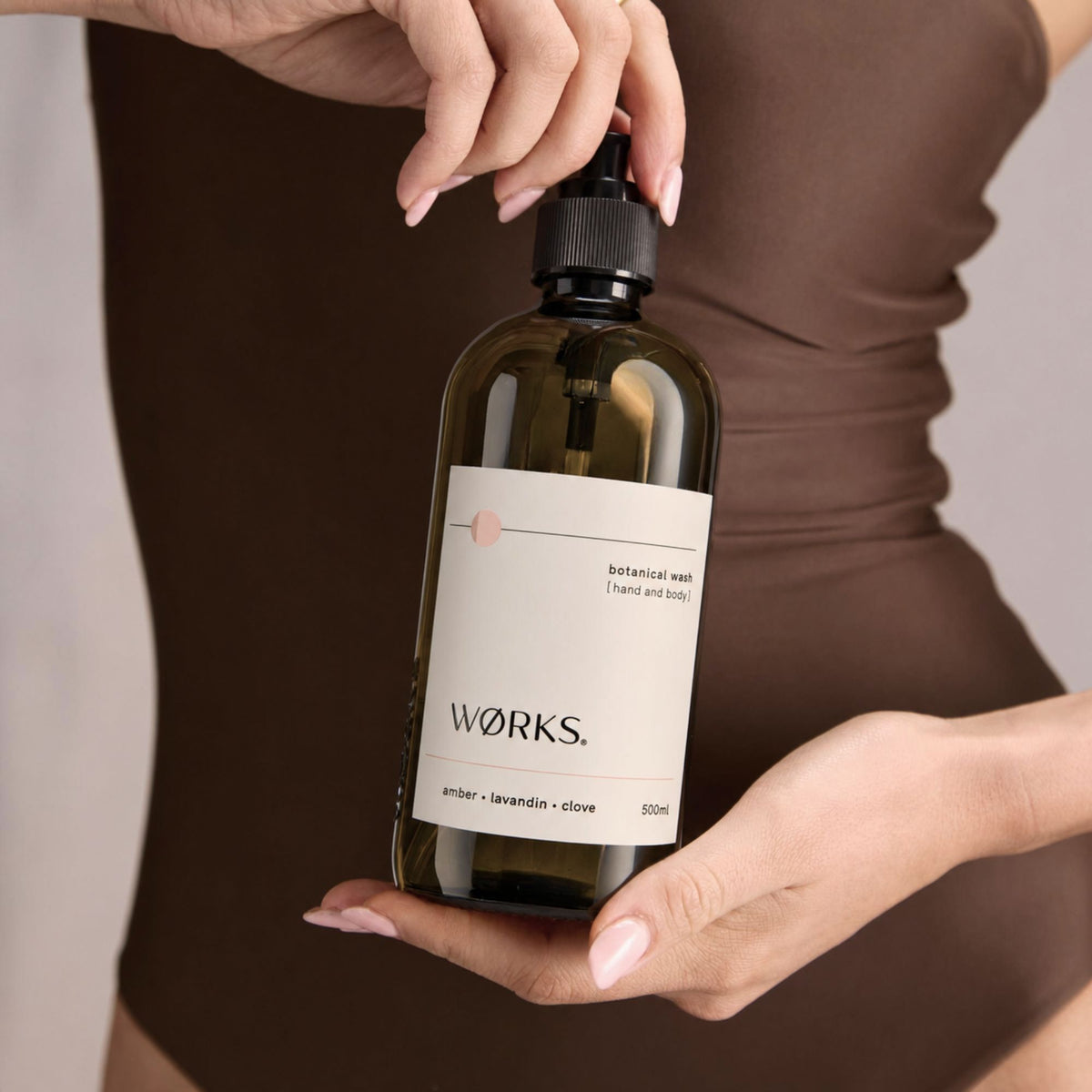 Model holding WØRKS Amber Wash 500ml