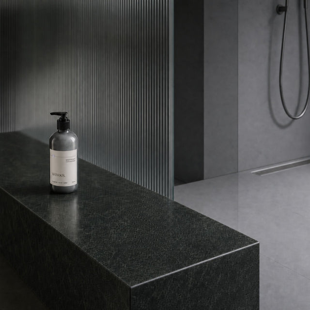 WØRKS Bergamot Botanical Balm 500ml styled in situ on a bathroom shelf