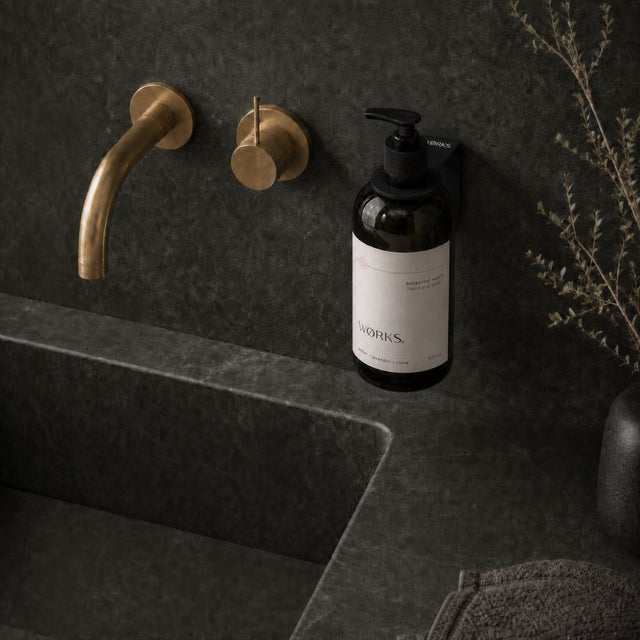 WØRKS Wall Bracket in matte black styled in situ, mounted on a tiled wall