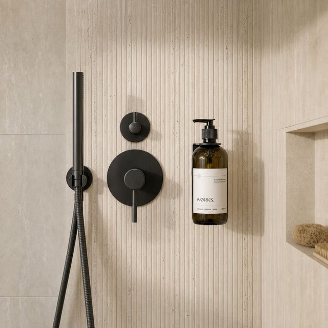 WØRKS Wall Bracket in matte black styled in situ in a bathroom
