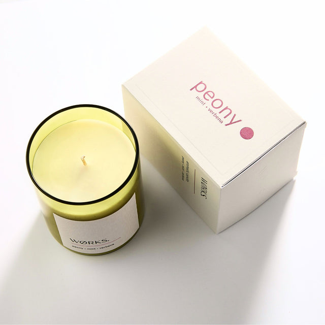 WØRKS Peony Aromatic Candle in smoked glass jar shown with its packaging box