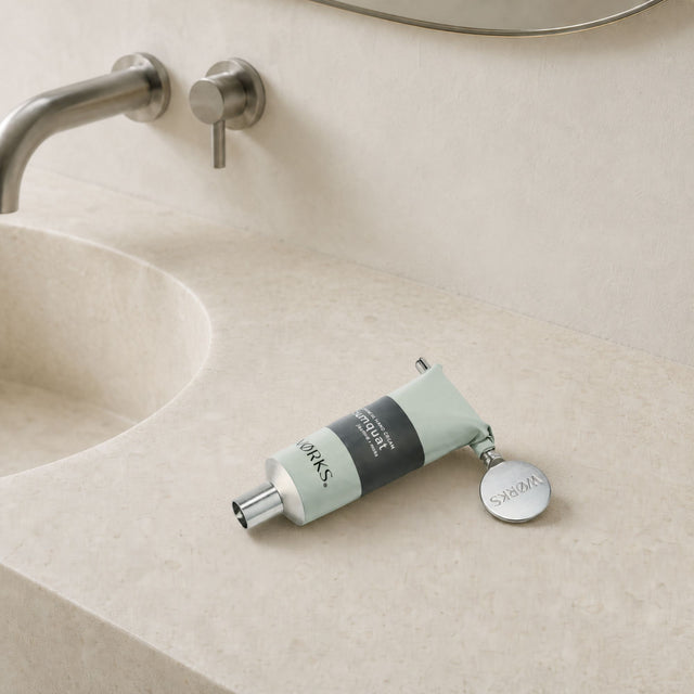 WØRKS Aluminium Tube Key styled in situ on a bathroom shelf
