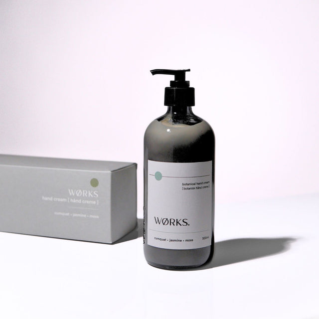 Cumquat 500ml hand cream with minimal design and luxurious texture, captured in soft natural light